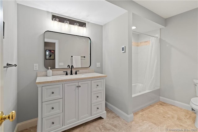 full bathroom featuring shower / tub combo with curtain, vanity, and toilet