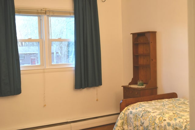 bedroom featuring a baseboard radiator