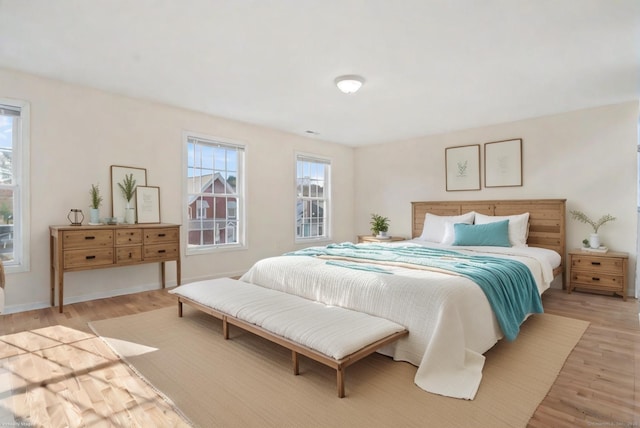 bedroom with light wood-type flooring