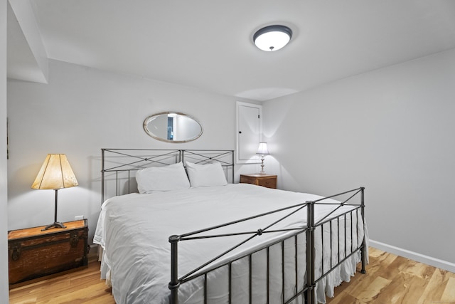 bedroom with light wood-type flooring