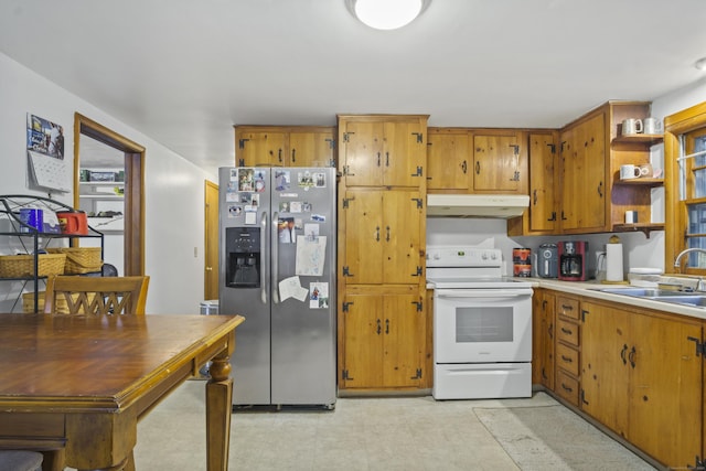 kitchen featuring sink, electric range, and stainless steel fridge with ice dispenser