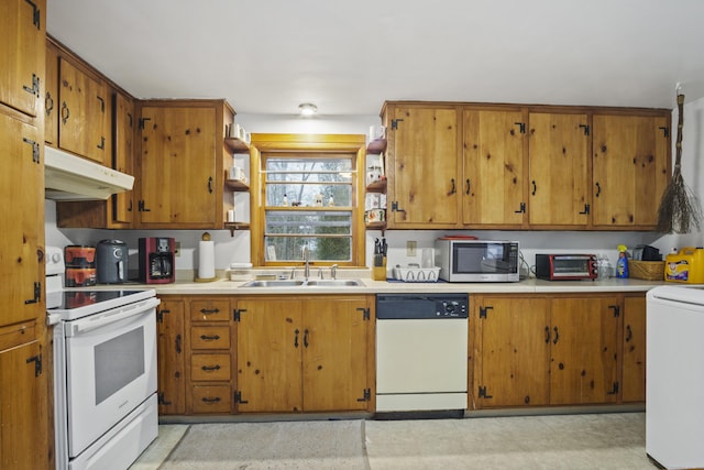 kitchen with sink and white appliances