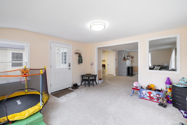 recreation room with light carpet