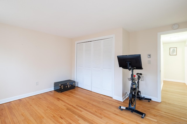 exercise room with hardwood / wood-style flooring