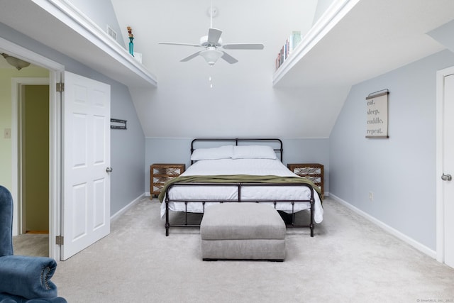 carpeted bedroom featuring lofted ceiling and ceiling fan