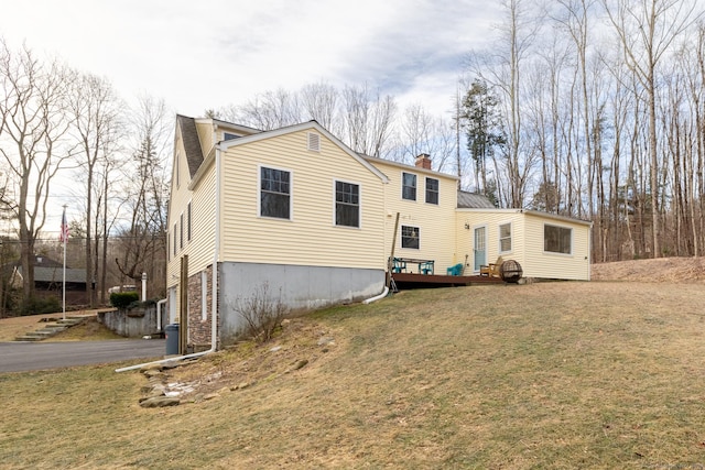 back of house with a yard