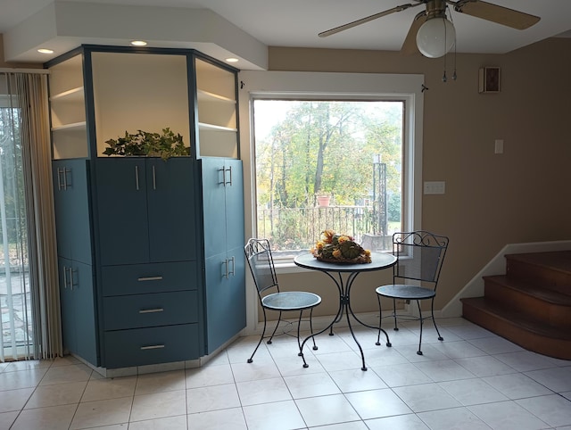 dining space featuring a wealth of natural light, light tile patterned floors, and ceiling fan