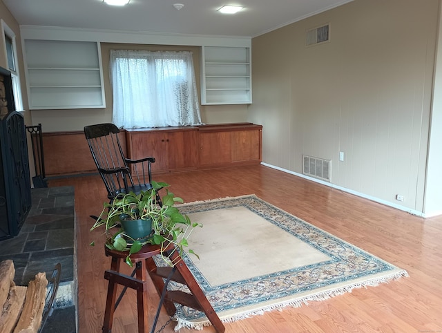 interior space featuring dark hardwood / wood-style flooring and ornamental molding