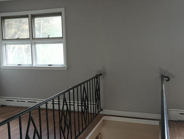 stairs featuring wood-type flooring