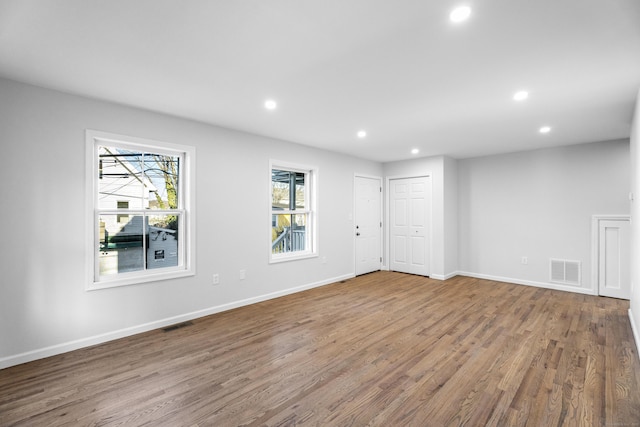 spare room with hardwood / wood-style flooring