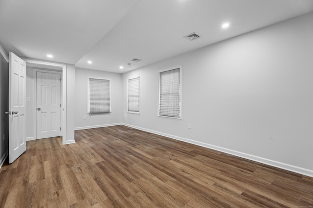 spare room with hardwood / wood-style floors