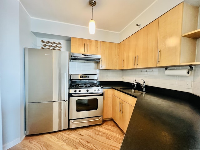 kitchen with sink, light brown cabinets, light hardwood / wood-style floors, decorative backsplash, and appliances with stainless steel finishes