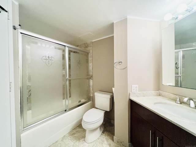 full bathroom featuring shower / bath combination with glass door, vanity, and toilet