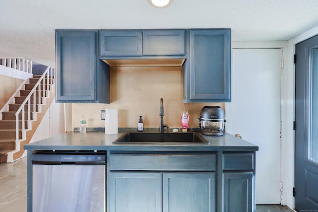 kitchen with kitchen peninsula, dishwasher, a textured ceiling, and sink