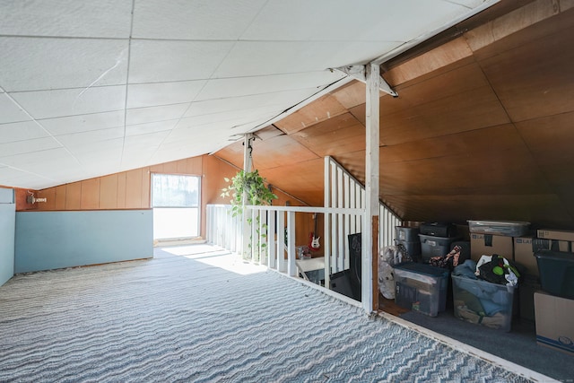 bonus room with carpet and lofted ceiling