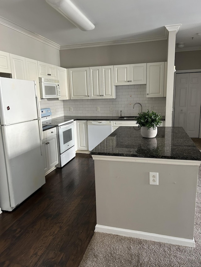 kitchen featuring white appliances, white cabinets, sink, decorative backsplash, and ornamental molding