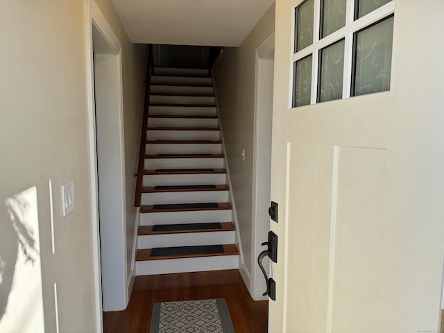 stairs with hardwood / wood-style floors