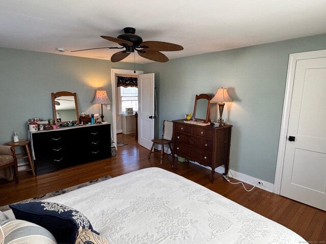 bedroom featuring ceiling fan and dark hardwood / wood-style flooring