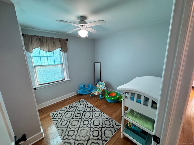 interior space with hardwood / wood-style floors and ceiling fan