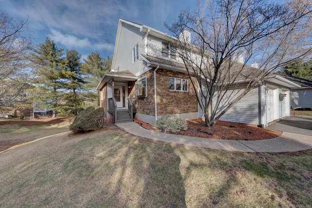 view of front facade with a front yard and a garage