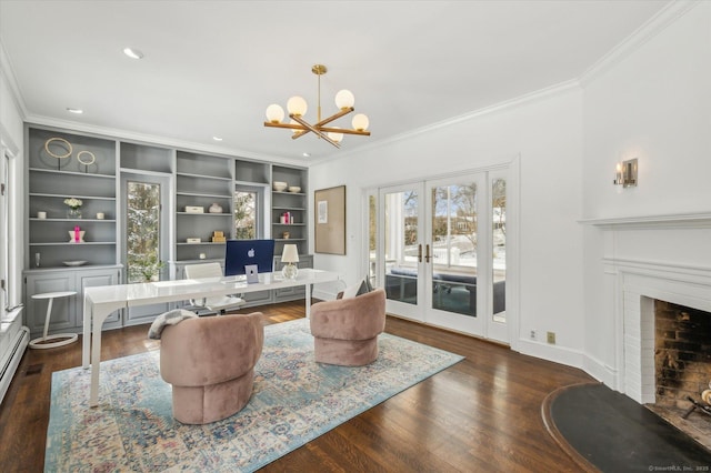 office with a chandelier, a brick fireplace, french doors, built in features, and dark hardwood / wood-style floors