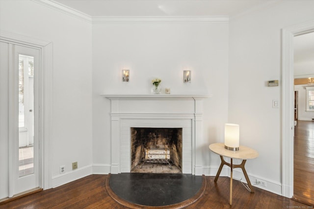 room details featuring wood-type flooring, a brick fireplace, and ornamental molding