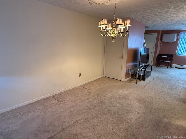 unfurnished dining area featuring carpet floors, a notable chandelier, a textured ceiling, and a baseboard radiator