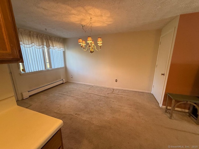 dining room with a baseboard heating unit, a chandelier, a textured ceiling, and light carpet