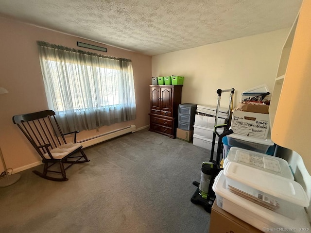 home office with a textured ceiling, carpet flooring, and a baseboard radiator