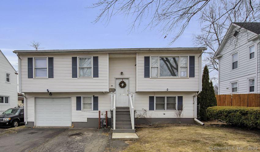 bi-level home featuring a garage