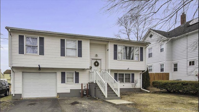 bi-level home featuring a garage