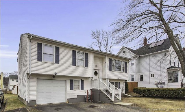 bi-level home featuring a garage