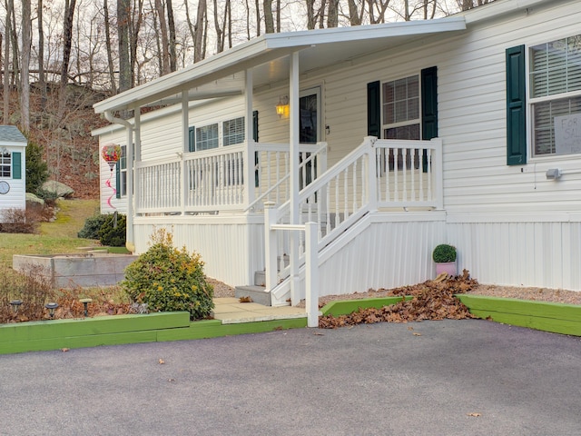 doorway to property featuring covered porch