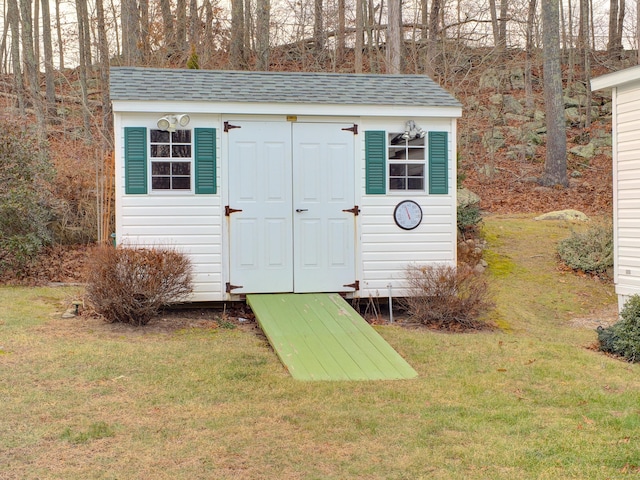 view of outdoor structure with a yard