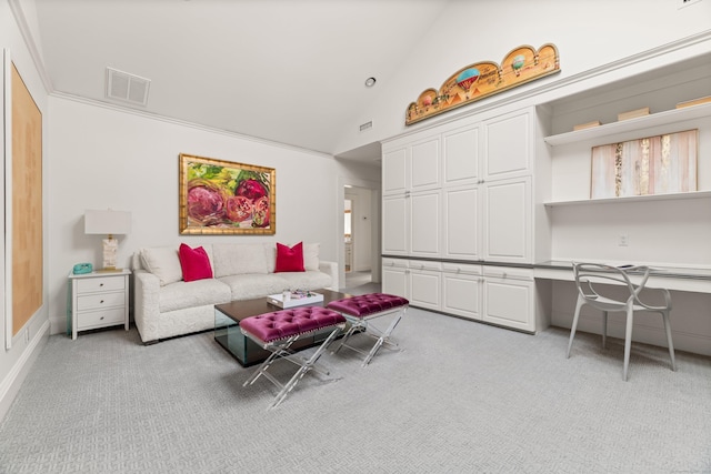 carpeted living room featuring high vaulted ceiling and built in desk