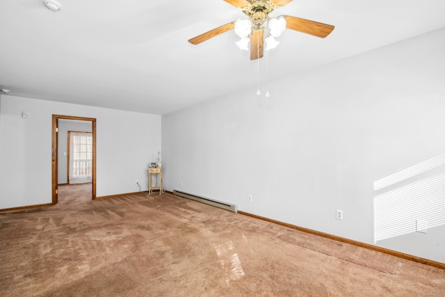 spare room with ceiling fan, baseboard heating, and carpet