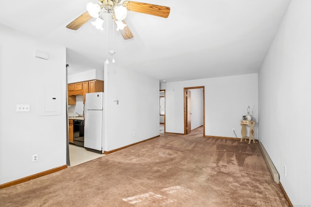 empty room with ceiling fan and light colored carpet