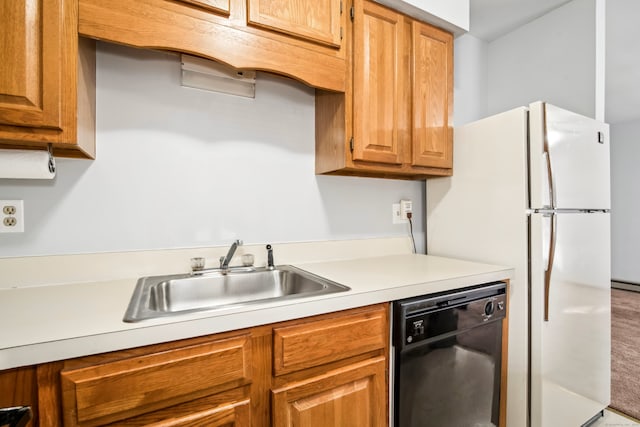 kitchen with sink, black dishwasher, baseboard heating, and white fridge