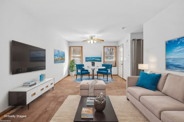 living room with ceiling fan and light colored carpet