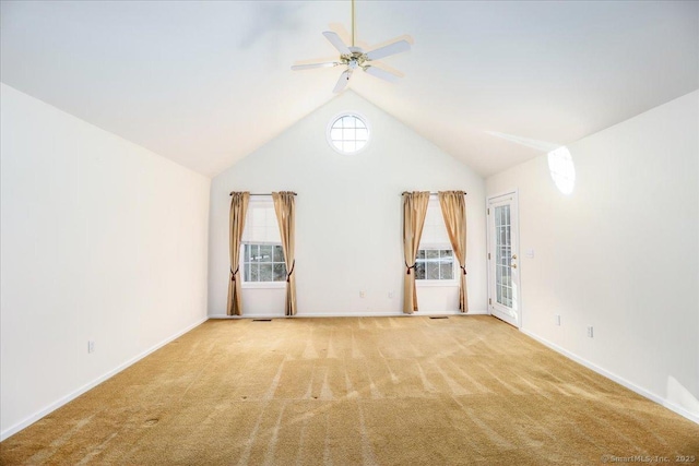 unfurnished room with ceiling fan, light colored carpet, and lofted ceiling