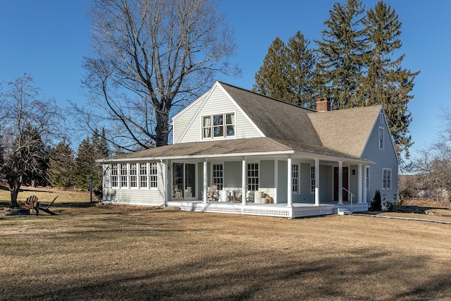 back of property with a lawn