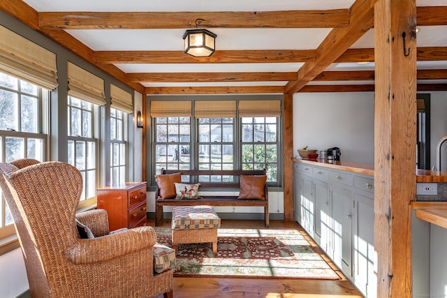 sunroom with beamed ceiling and coffered ceiling