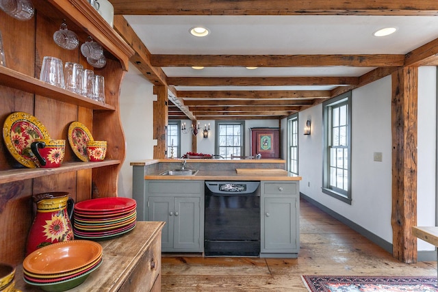 kitchen featuring gray cabinetry, sink, black dishwasher, beamed ceiling, and light hardwood / wood-style floors