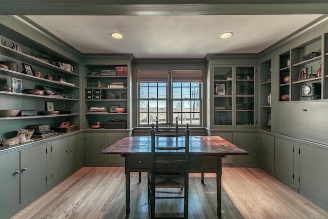 interior space with built in shelves, light wood-type flooring, and crown molding