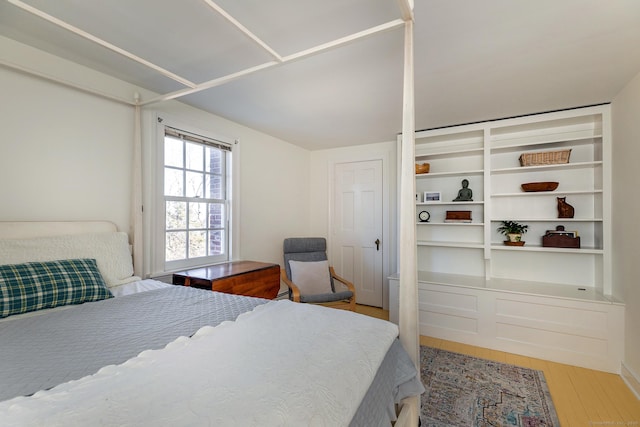 bedroom with wood-type flooring