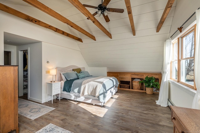 bedroom featuring vaulted ceiling with beams, dark hardwood / wood-style floors, ceiling fan, and a baseboard heating unit