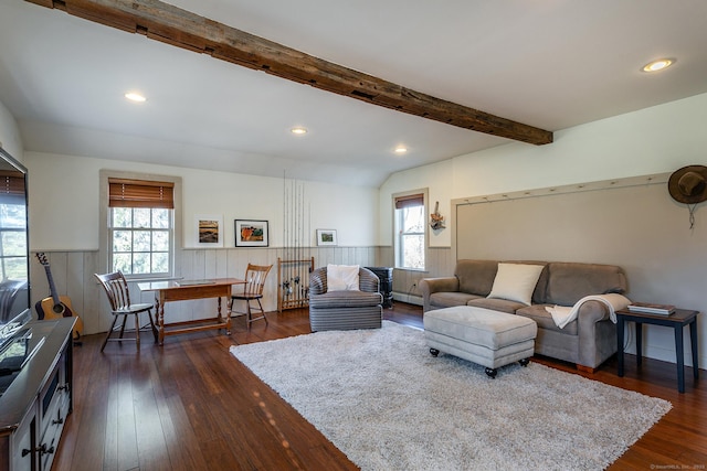 living room with dark hardwood / wood-style flooring and lofted ceiling with beams