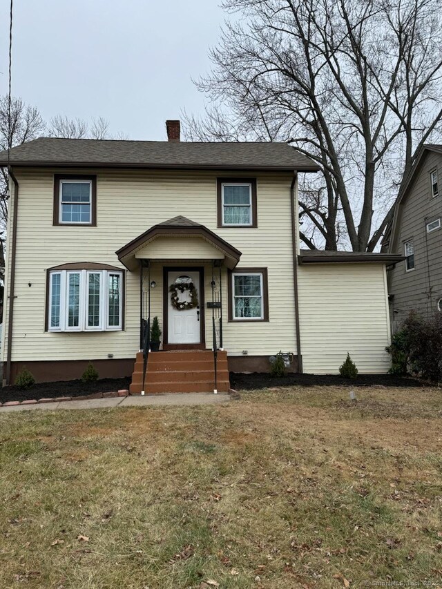 view of property featuring a front yard