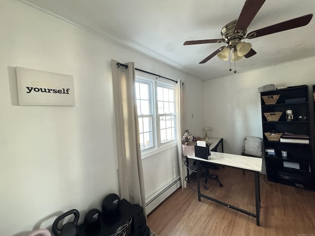 office with hardwood / wood-style flooring, a baseboard radiator, and ceiling fan