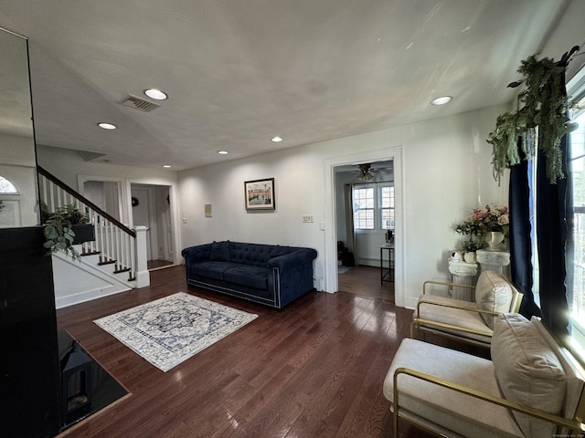 living room with dark hardwood / wood-style floors